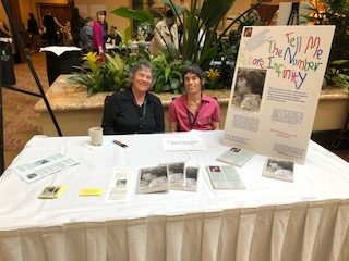 picture of Dena and Becky at their table at the
                  CalT
